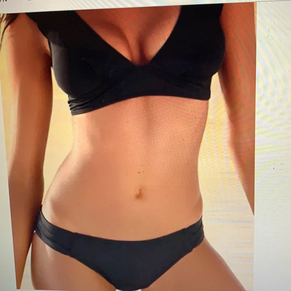 Bikini, black, low cut very cheeky bottoms.